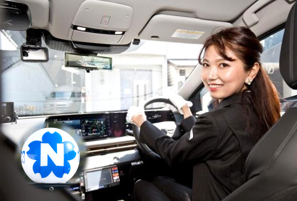 Smiling woman driving a modern car, hands on the steering wheel with a digital dashboard visible ahead.
